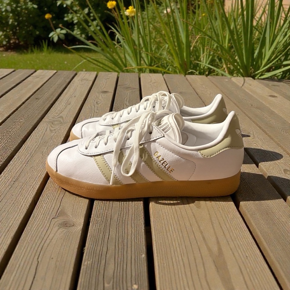Adidas Gazelle White Leather Sneakers with Tan Stripes.